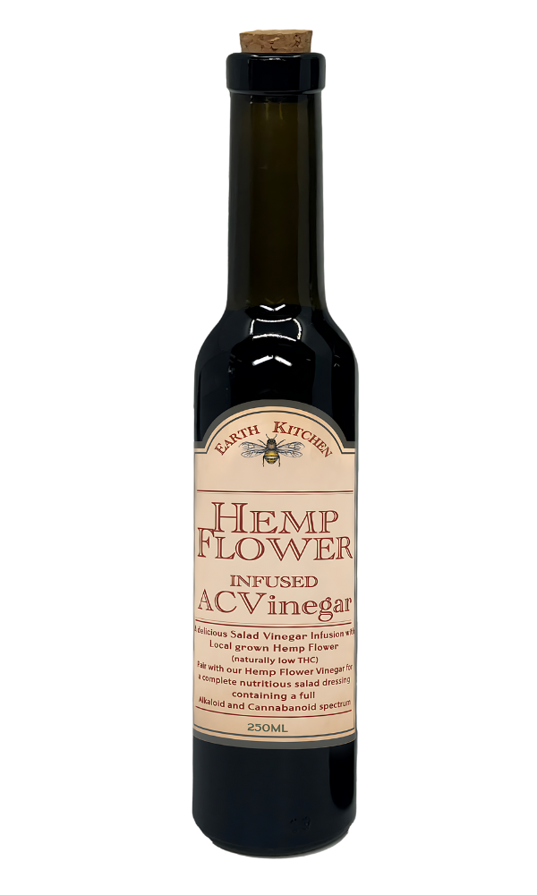 Hemp Flower Infused Apple Cider Vinegar bottle from Earth Kitchen, 250ml, featuring a dark glass bottle with cork stopper, labeled as a delicious salad vinegar infusion with locally grown hemp flower, naturally low in THC.